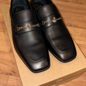 Christian Louboutin
MJ Moc chain-detail leather loafers